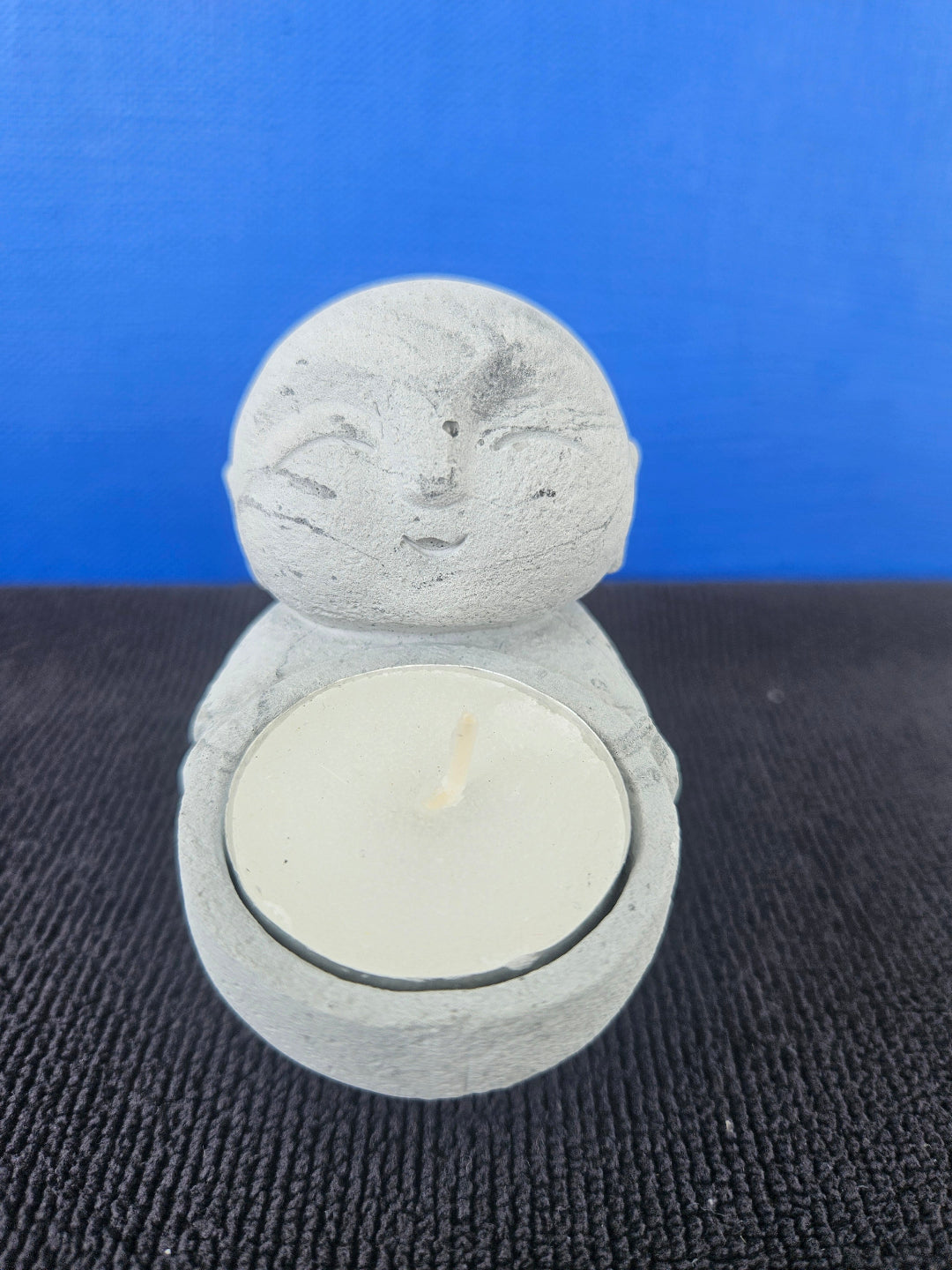 Stone Buddha's with tea light candles
