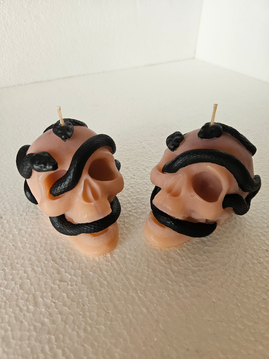 Serpent skull candles