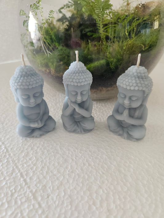 Praying baby Buddha candles