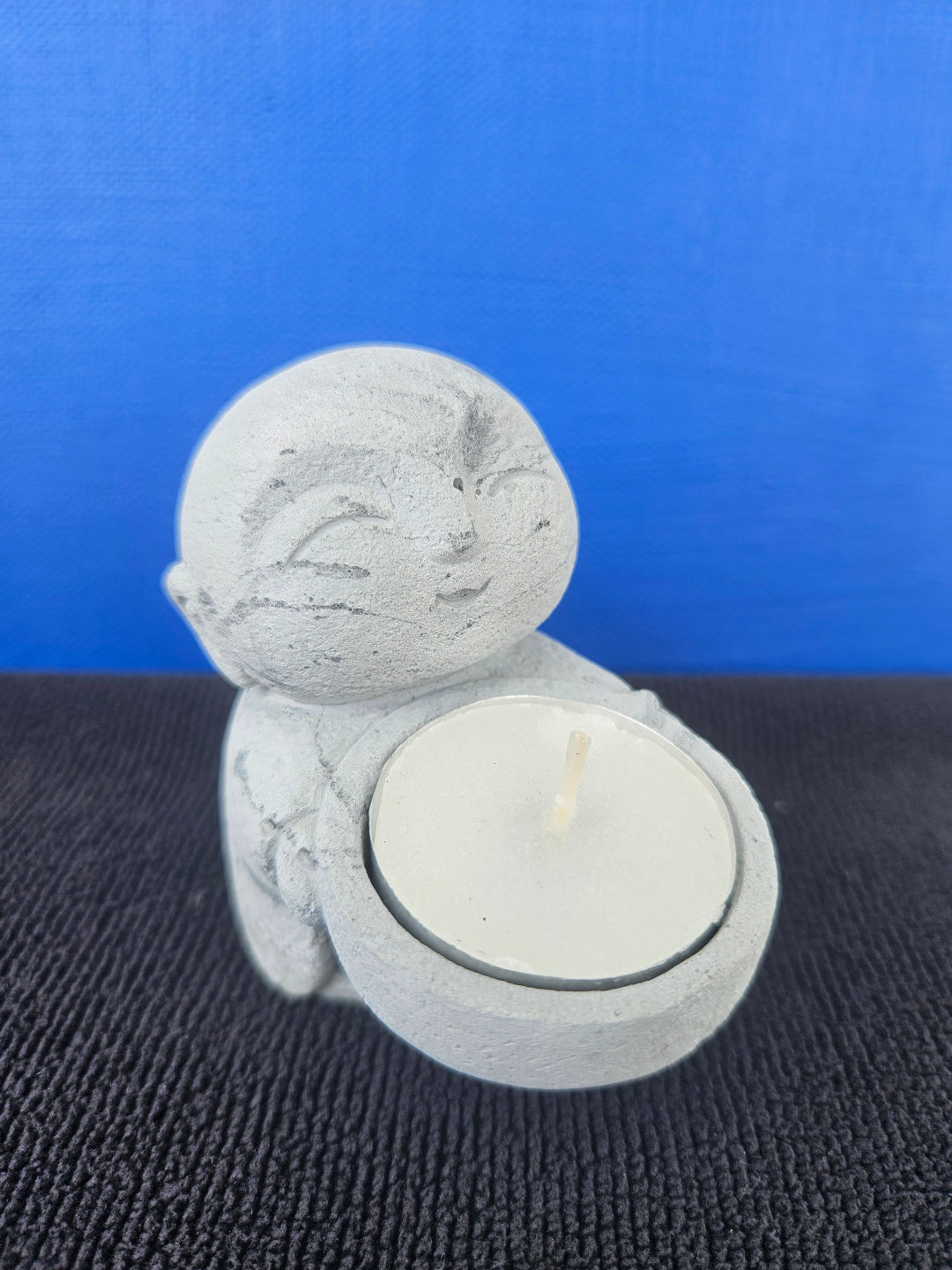 Stone Buddha's with tea light candles