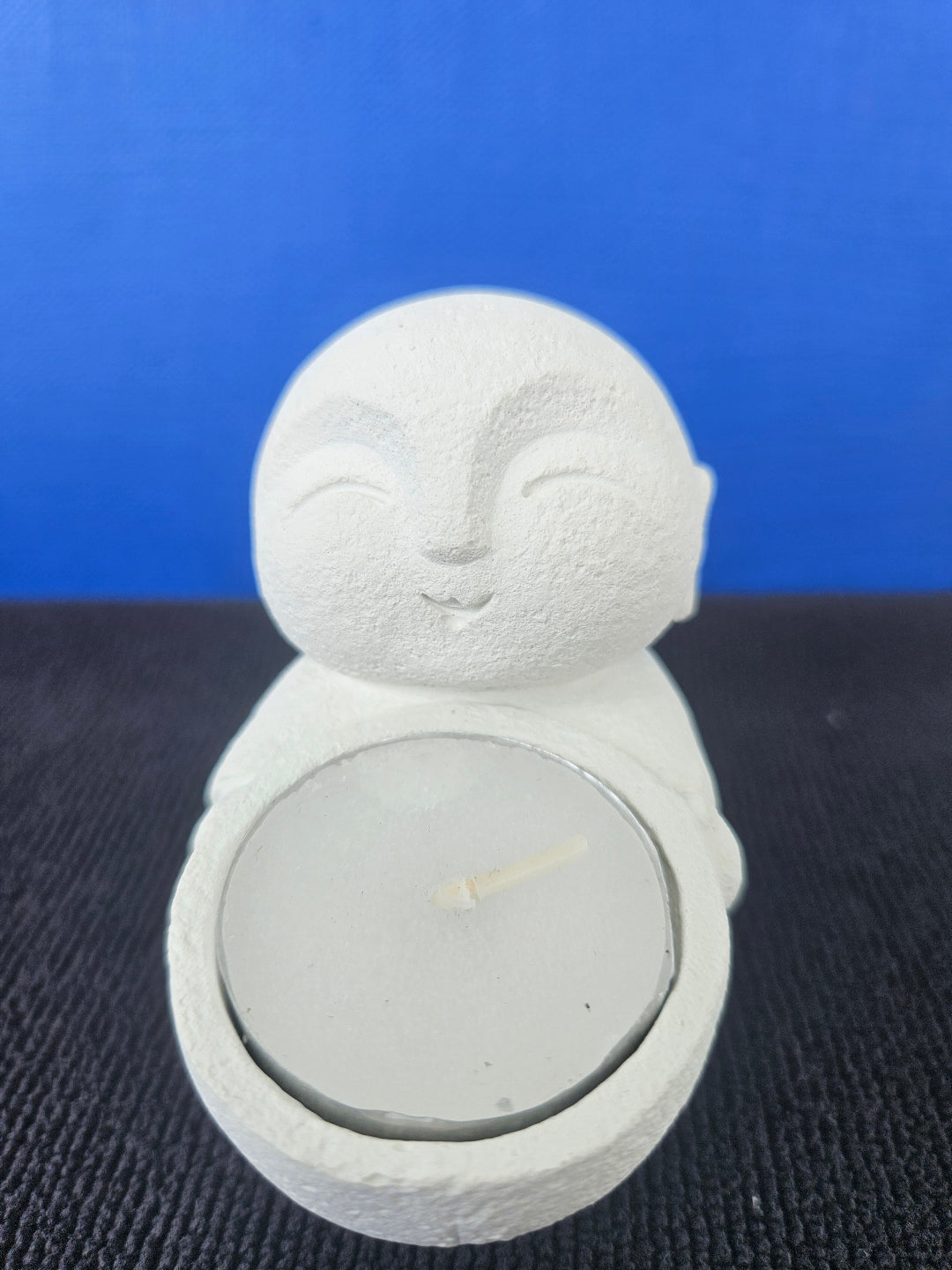 Stone Buddha's with tea light candles