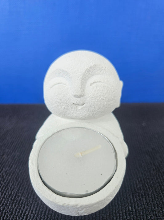 Stone Buddha's with tea light candles