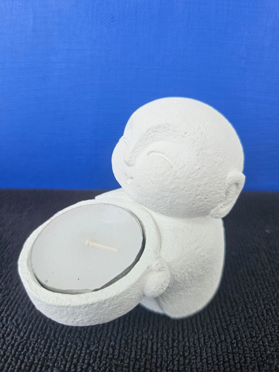 Stone Buddha's with tea light candles
