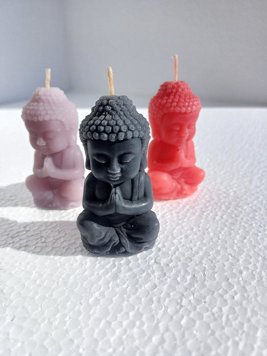 Praying baby Buddha candles