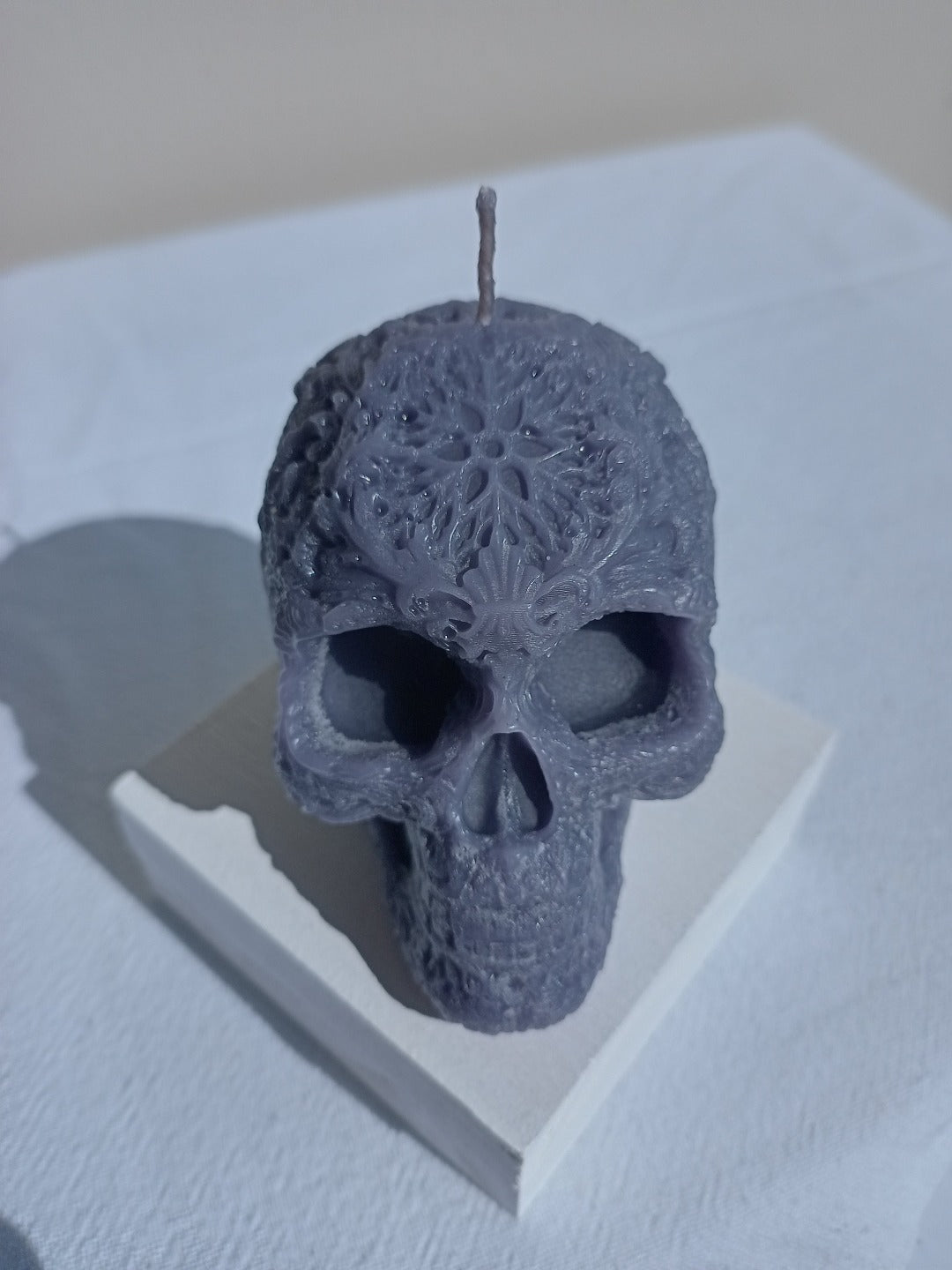 Star forehead skull candles with intricate detail