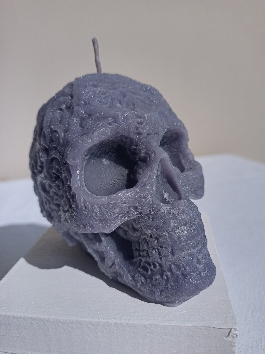 Star forehead skull candles with intricate detail